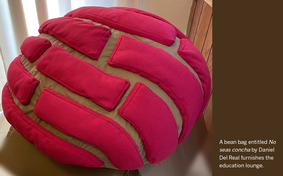 A bean bag entitled No seas concha by Daniel Del Real furnishes the education lounge.